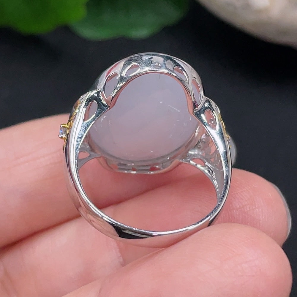 Huiliu jadeite ring with diamond accents, elegant jewelry featuring a polished jadeite gemstone and sparkling diamond details.