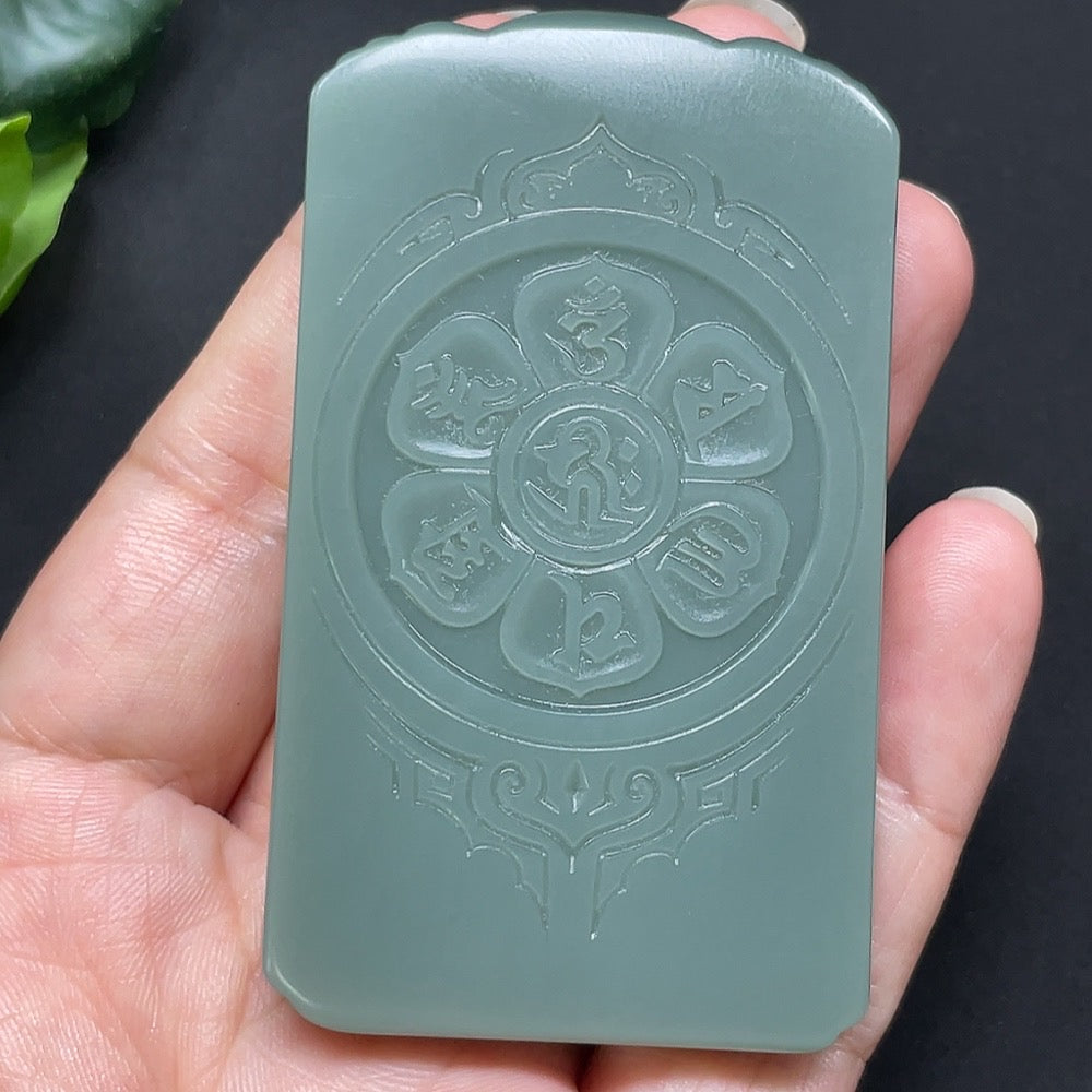 Hetian Jade Jasper Guanyin pendant, natural green and brown tones, detailed carved figure, weighs approximately 79.6 grams.