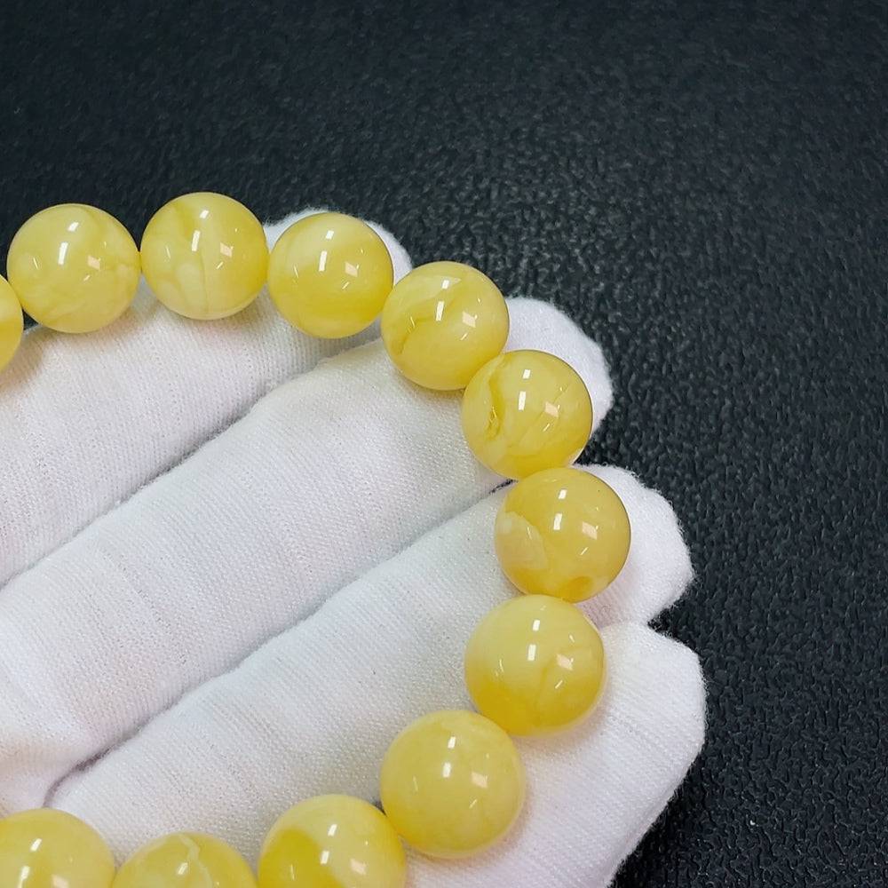 Huiliu Amber Beeswax bracelet with 12.2mm beads, natural amber jewelry, certified by HUILIU HQ.