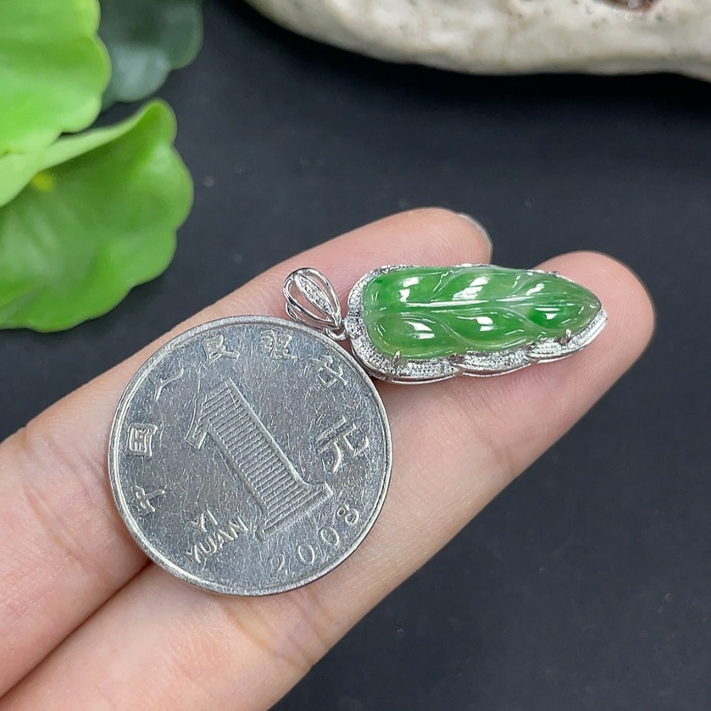 Jadeite leaf pendant in 18K gold with diamond accents, elegant necklace featuring detailed leaf design and sparkling gemstones.