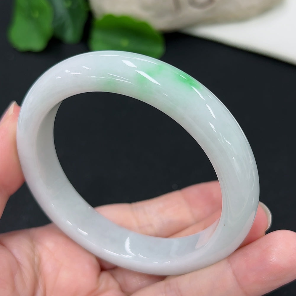HKHQ jadeite round bangle in size 57.4, showcasing smooth, polished jadeite with a rounded shape and elegant design.