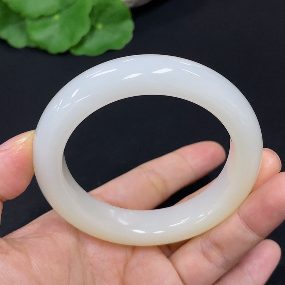 HKHQ Hetian Jade round bangle bracelet in size 52.2, with a smooth polished surface and natural jade coloration.