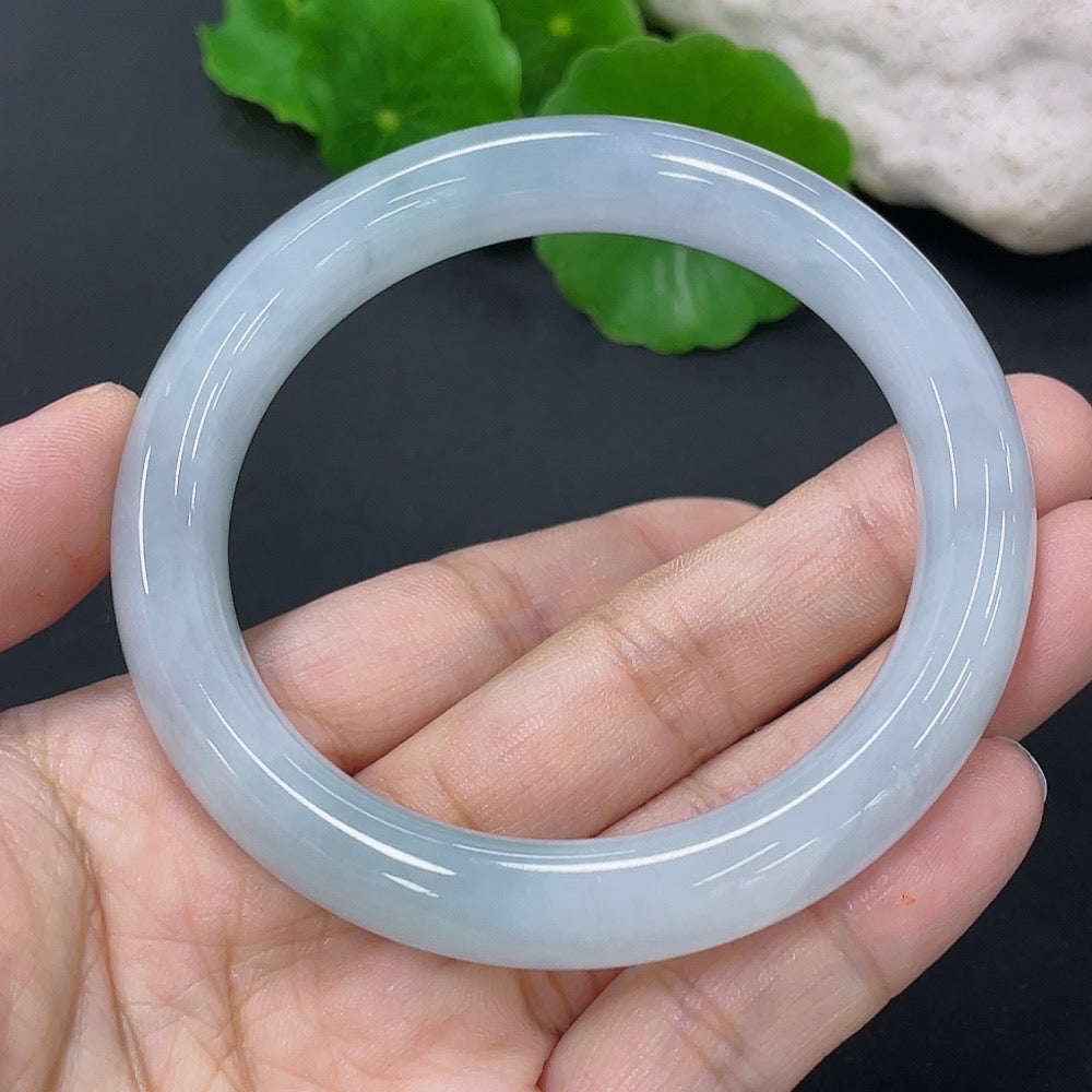 HKHQ jadeite round bangle in size 54, weighing 51.82g, displayed on a neutral background with detailed visibility of the bracelet's smooth surface.
