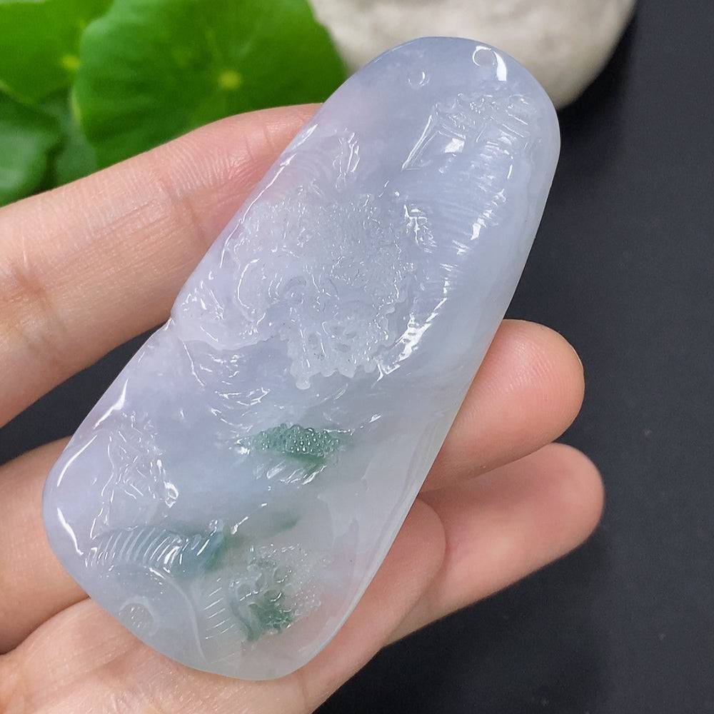 Huiliu Jadeite landscape pendant featuring intricate carved jade design on a polished pendant with a natural green hue.