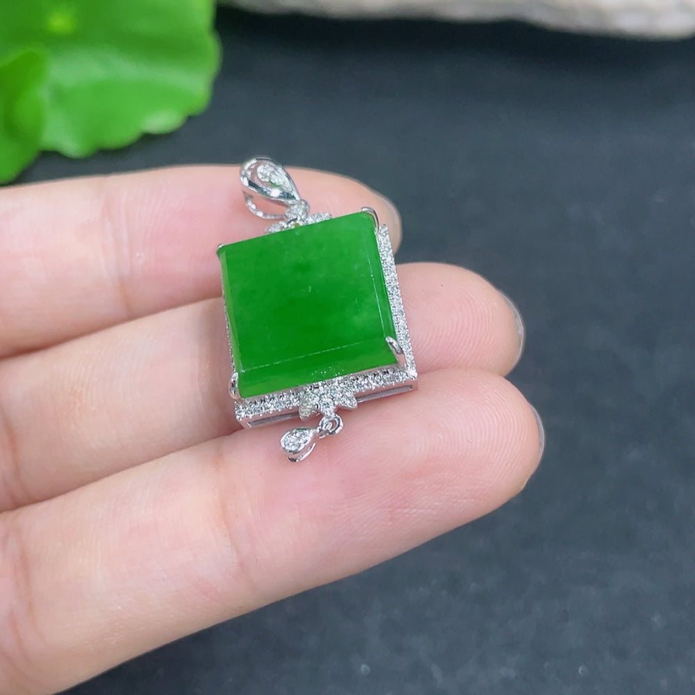 Jadeite pendant necklace with 18k gold and diamond accents, featuring a polished jadeite stone on a delicate chain.