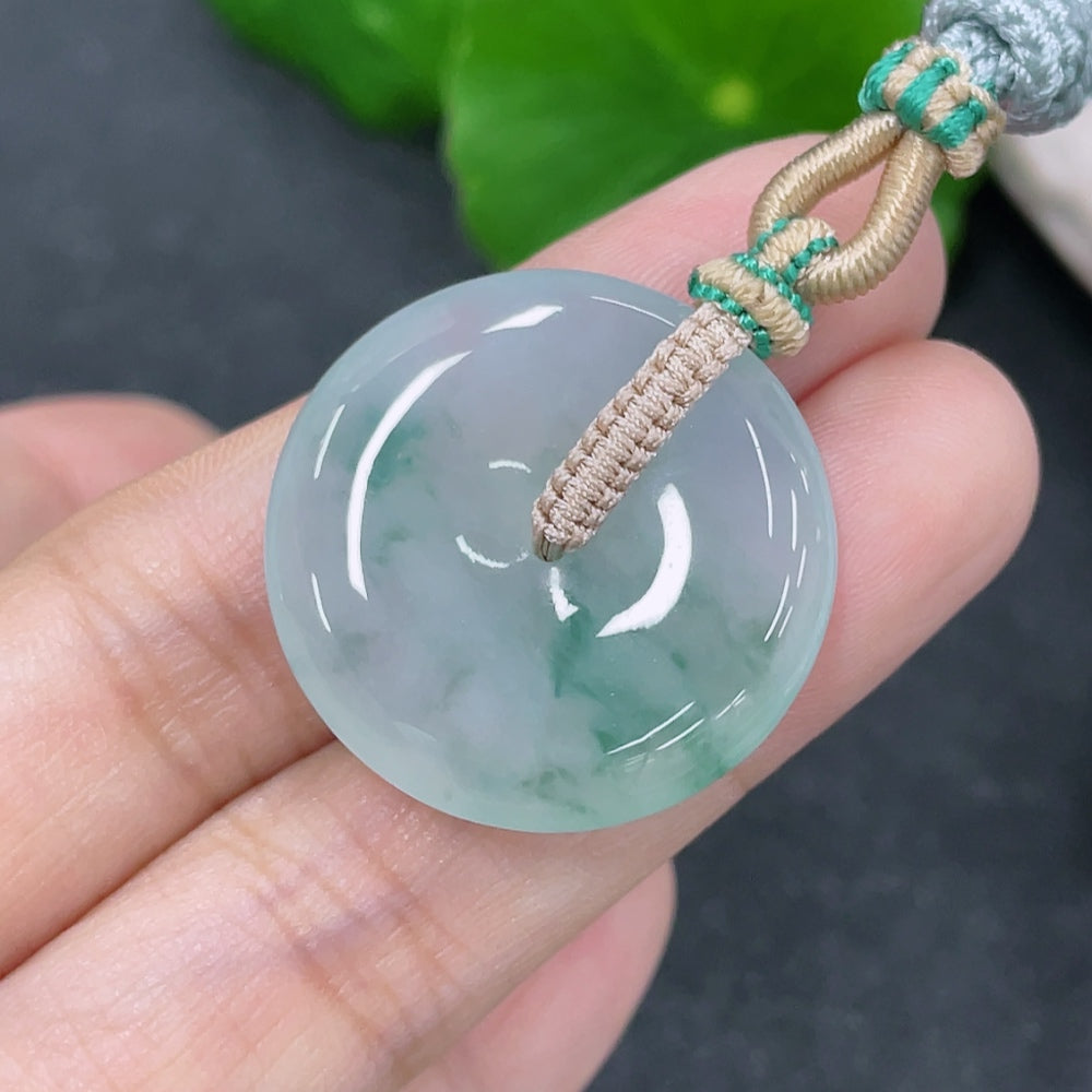 Jadeite safety buckle pendant with green jade, HKHQ brand, weighing approximately 8.49 grams, featuring a polished, smooth surface.
