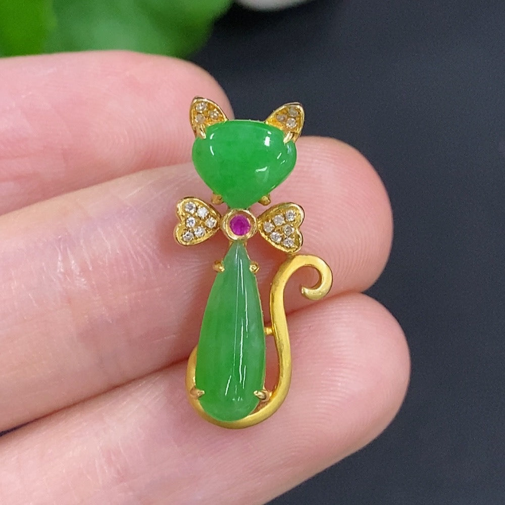 Jadeite pendant in 18K gold with diamond accents, showcasing a polished green jade piece on a delicate gold chain.