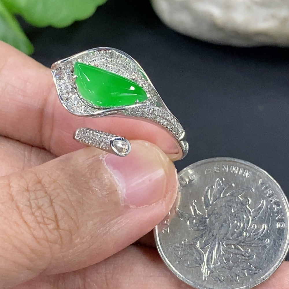 Jadeite freeform inlaid ring with 18K gold band and diamond accent, showcasing elegant jewelry design by HKHQ