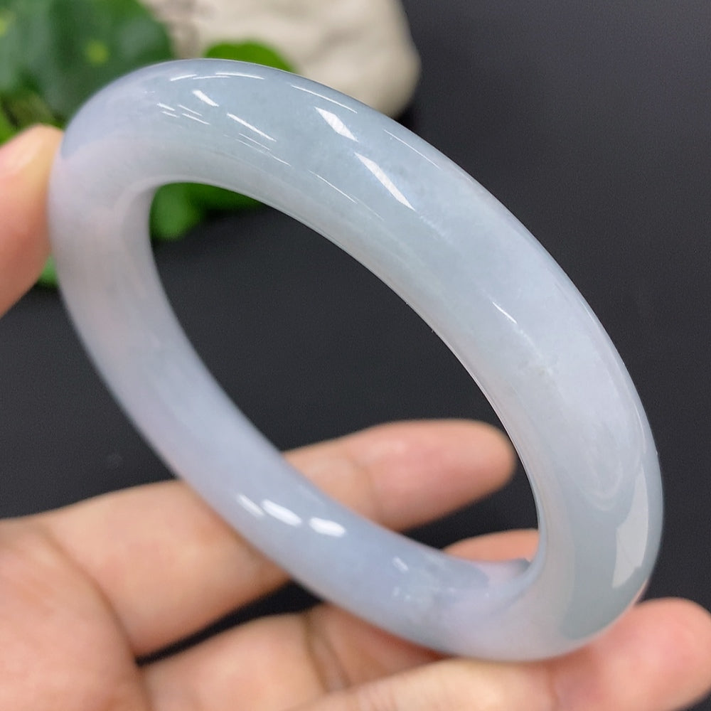 Huiliu HQ Jadeite round bangle showcasing smooth, polished jade surface with a natural green hue and elegant circular design.