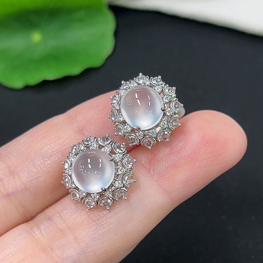 Jadeite earrings with 18k gold and diamond accents, unmarked, weighing approximately 4.9 grams, featuring smooth jade stones.