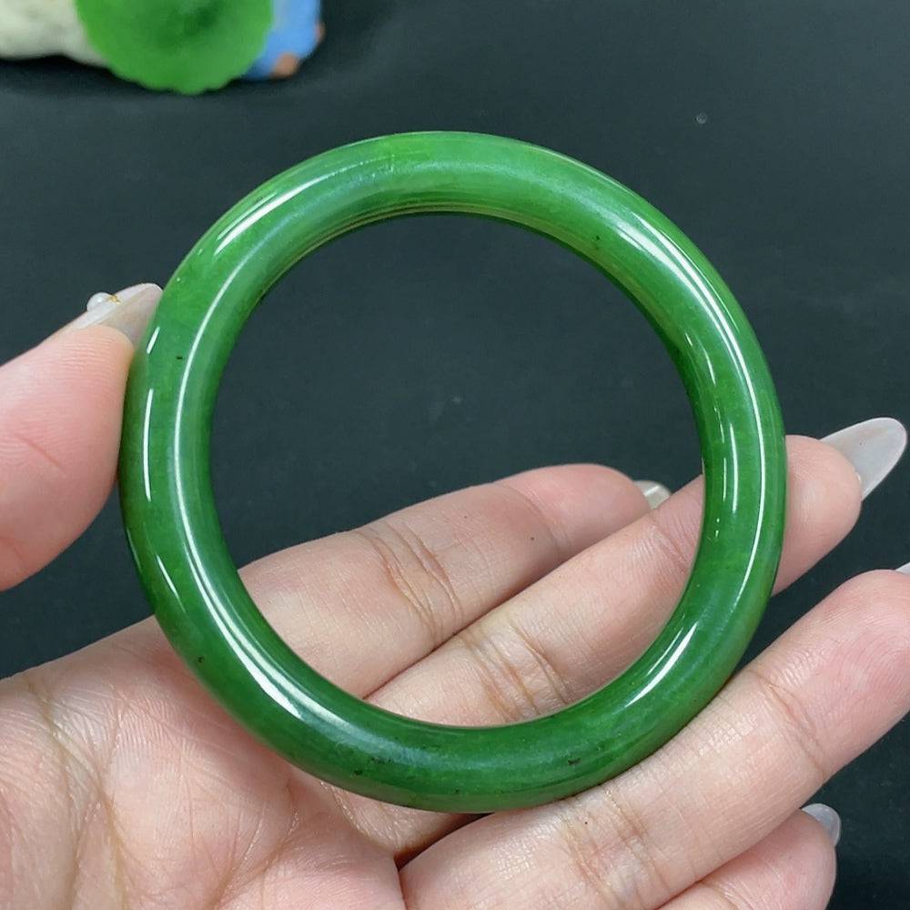 Green Hetian Jade round bangle by HUILIU HQ, smooth polished surface, size 55.7, weighs approximately 41.8g.