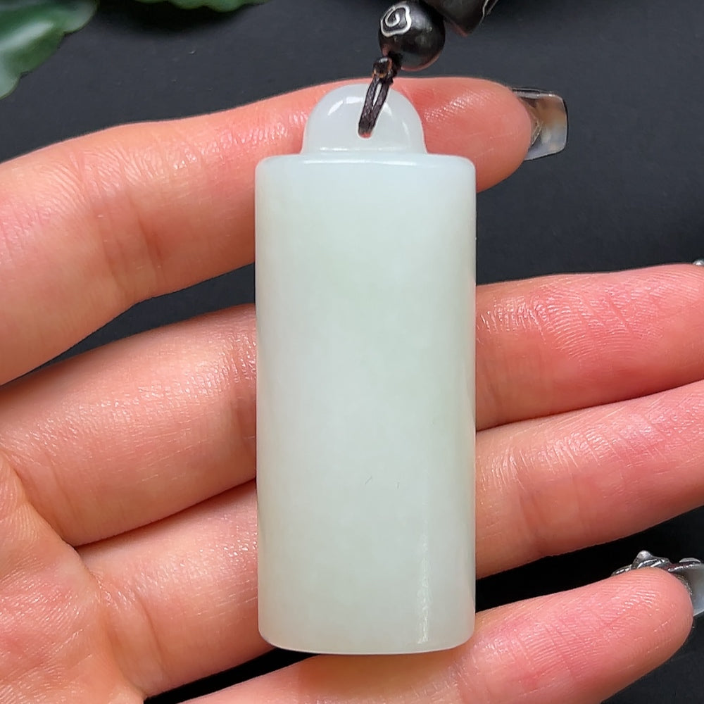 Hetian jade bamboo tube pendant necklace by HKHQ with a rope, weighing approximately 38.6g, showcasing intricate jade craftsmanship.
