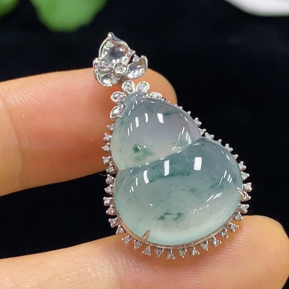 Jadeite gourd pendant with 18K gold and diamond inlay, crafted by HUILIU HQ, featuring intricate design and polished jade surface.