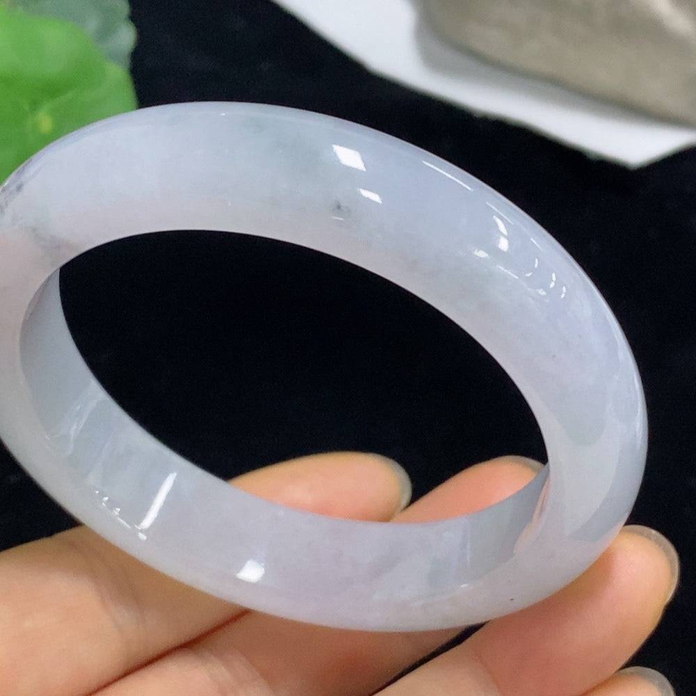 Huiliu Jadeite round bracelet featuring smooth, polished green jade beads on a delicate string.