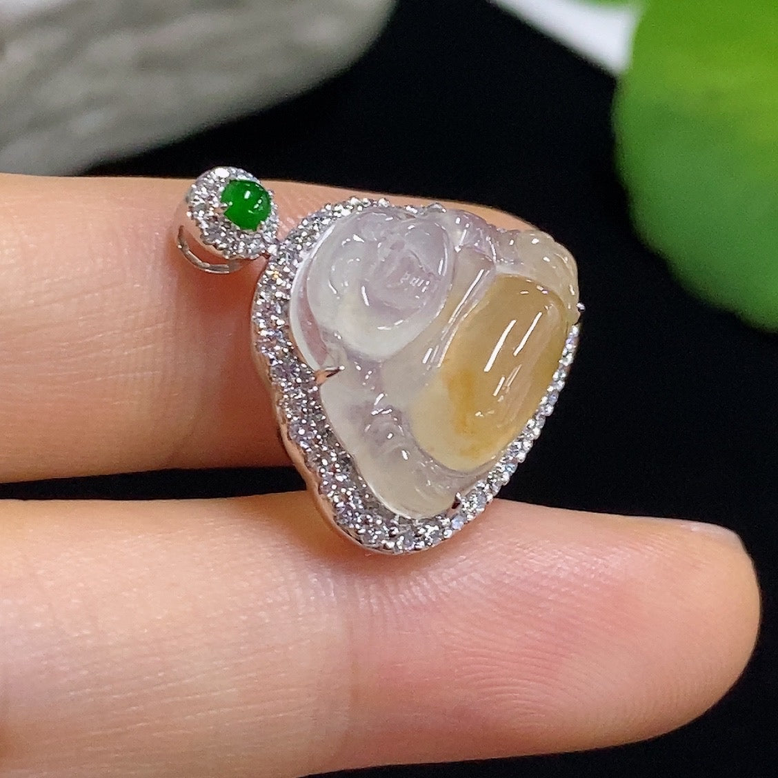 Jadeite Buddha pendant necklace by HKHQ with 18K gold and diamond accents, showcasing a detailed Buddha figure.