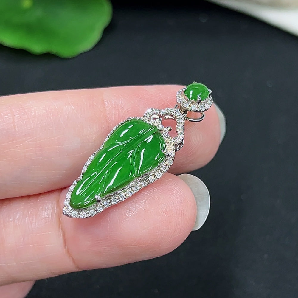 Jadeite leaf pendant with diamond accents, 18K gold, crafted by HKHQ, featuring a detailed jade leaf design with gold setting.