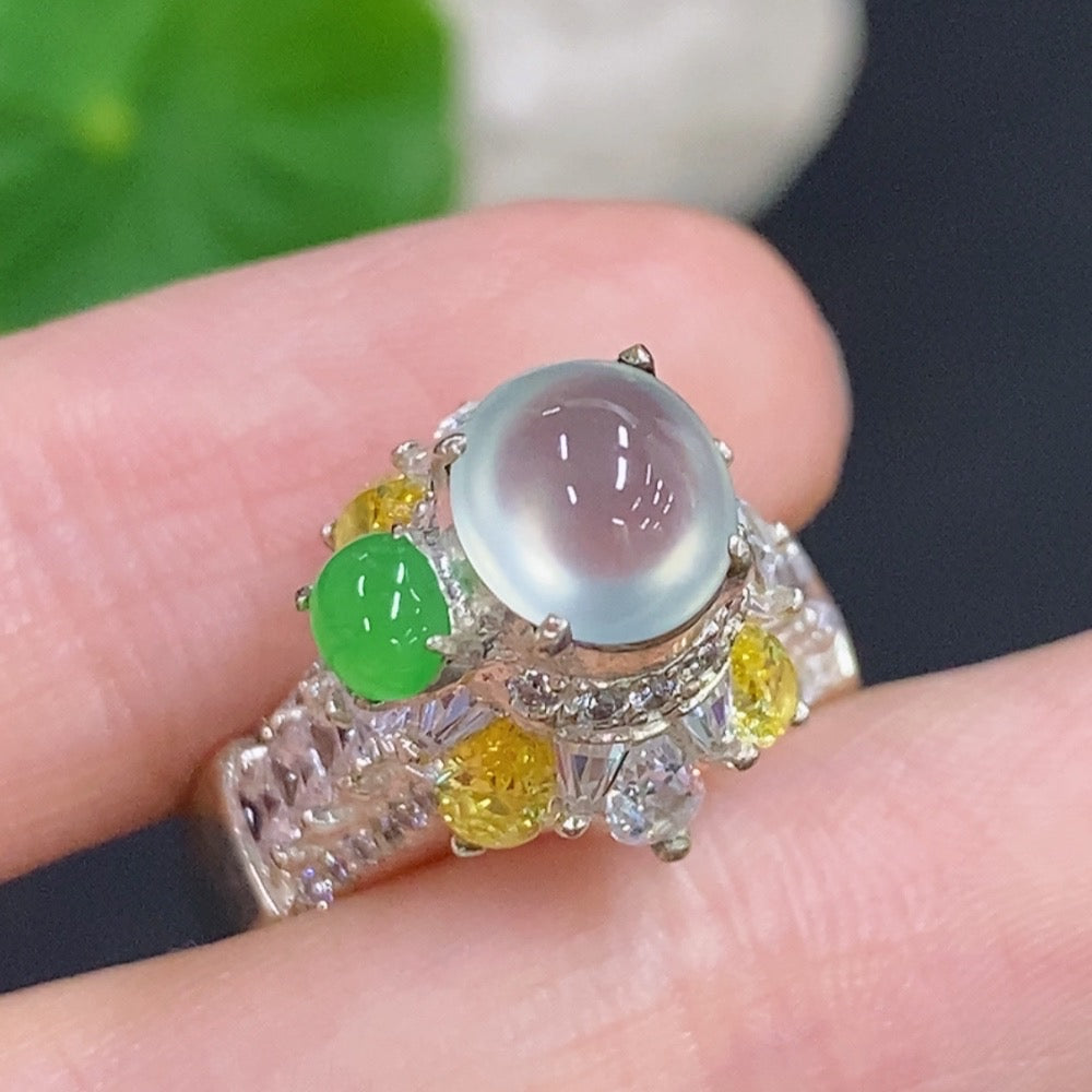 Two jadeite cabochons from HKHQ, natural green jade with smooth, polished surfaces, sold as a lot, non-gold setting.