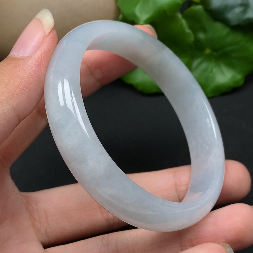 HKHQ jadeite round bangle size 56.5, smooth green jade with a polished surface, weighing approximately 43.17 grams.