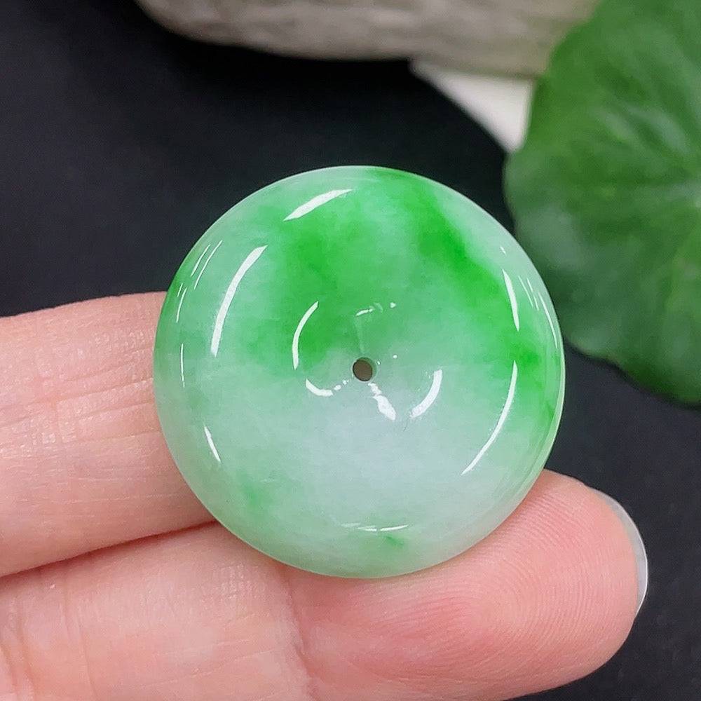 Jadeite Peace Knot pendant from HUILIU HQ, showcasing a smooth jade pendant with intricate knot design and polished finish.