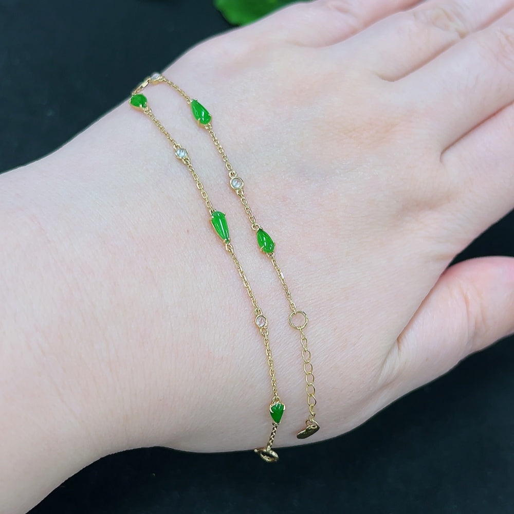 Jadeite inlaid bracelet with 18K gold accents, HKHQ, featuring smooth green jade stones and delicate gold detailing.