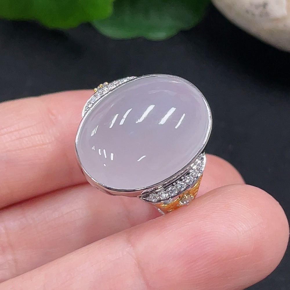 Huiliu Jadeite ring with diamond accents featuring a polished jade gemstone and intricate band design.