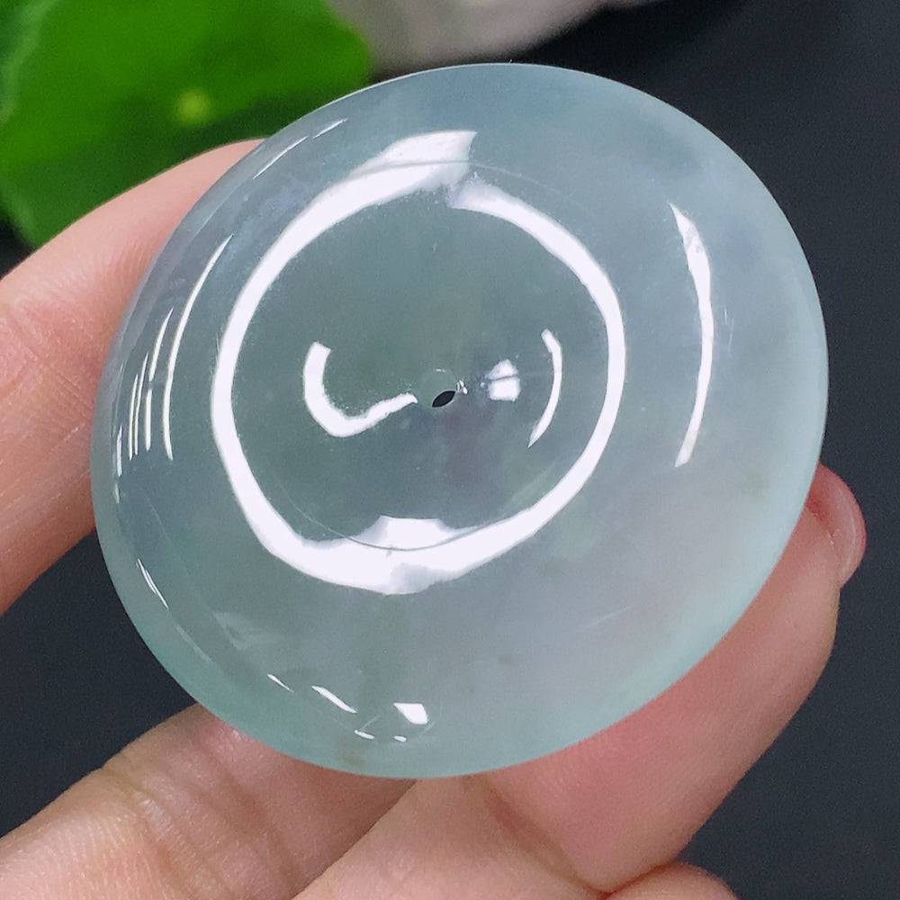 Jadeite pendant with peace knot design, crafted from jade, weighs approximately 20.19g, showcasing smooth green jade jewelry.