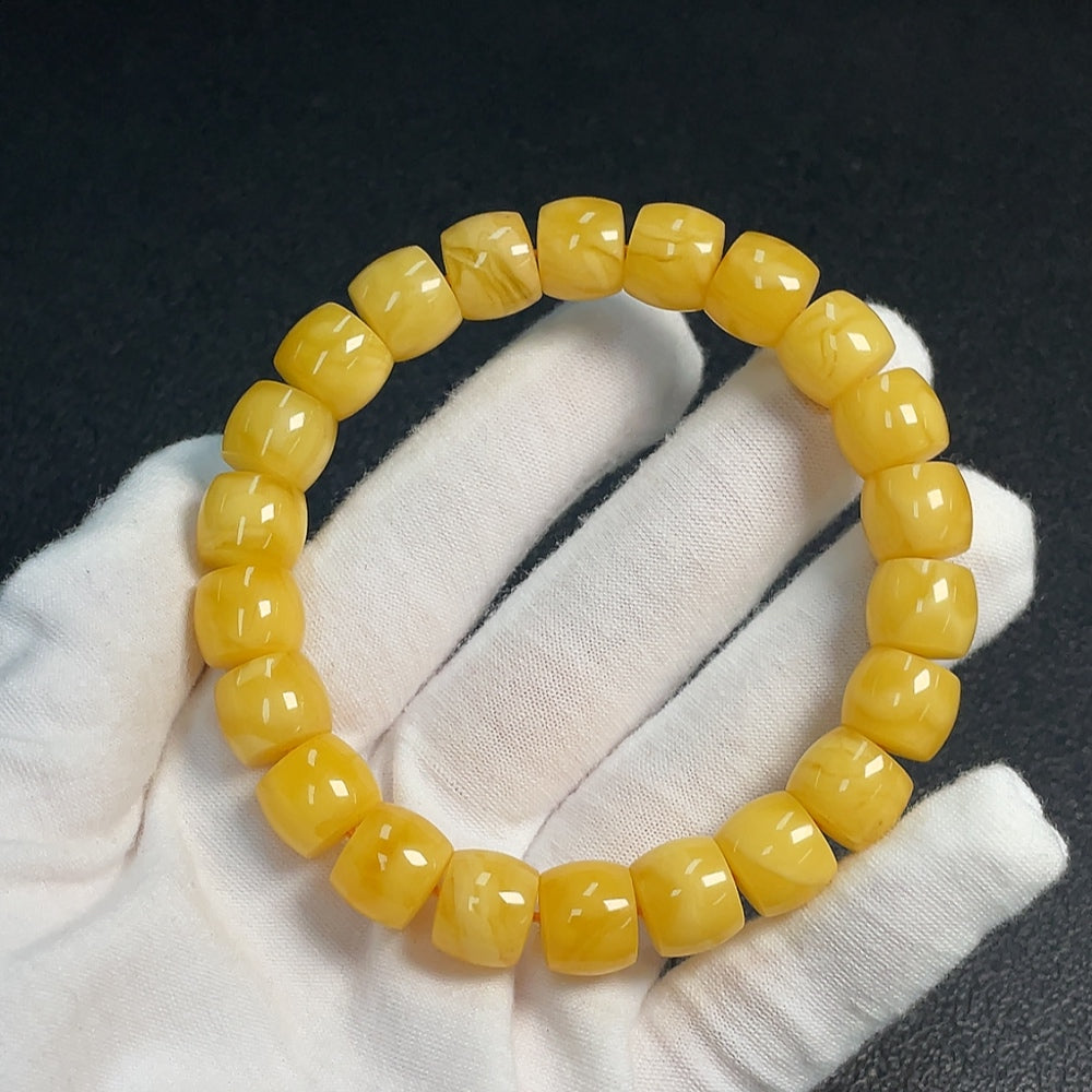Huiliu Amber Beeswax bracelet with 11.2mm beads, natural amber jewelry, certified by Huiliu, showcasing smooth, warm-toned beads.