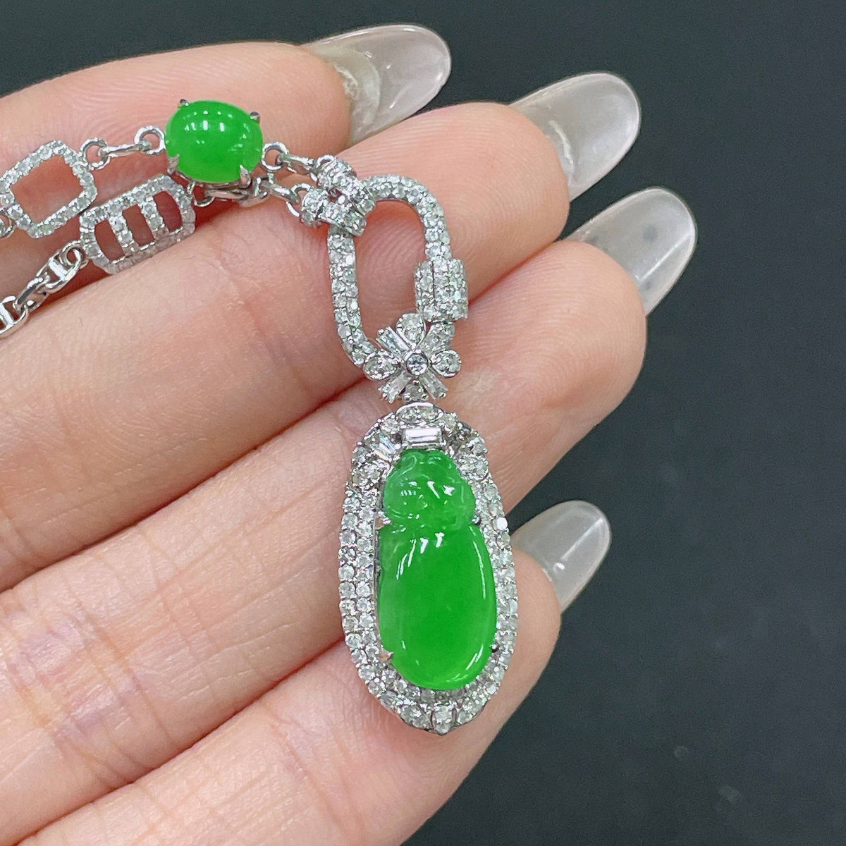 HUILIU HQ jadeite necklace with 18k gold and diamond accents, featuring a smooth jade pendant on a gold chain.
