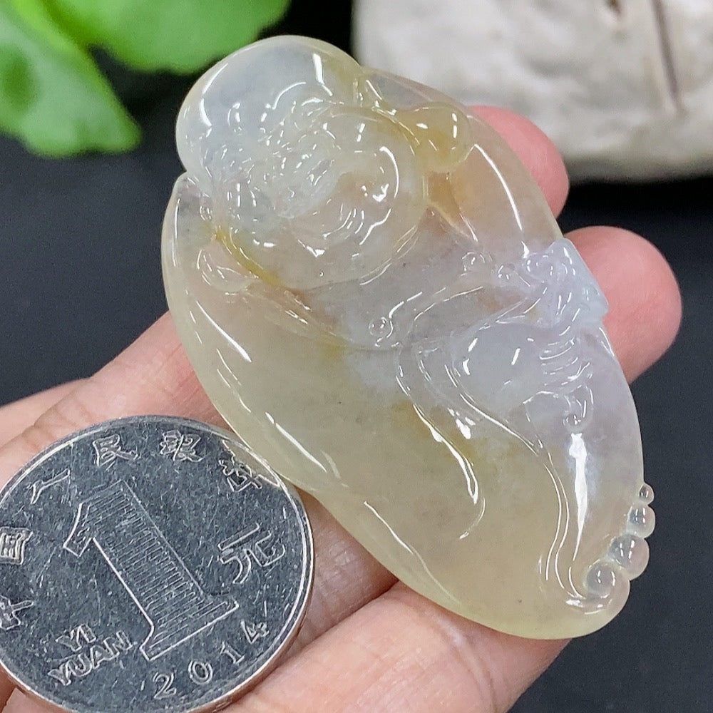 Jadeite Buddha pendant from HKHQ, intricately carved in vibrant green jade, weighing approximately 19.6 grams.
