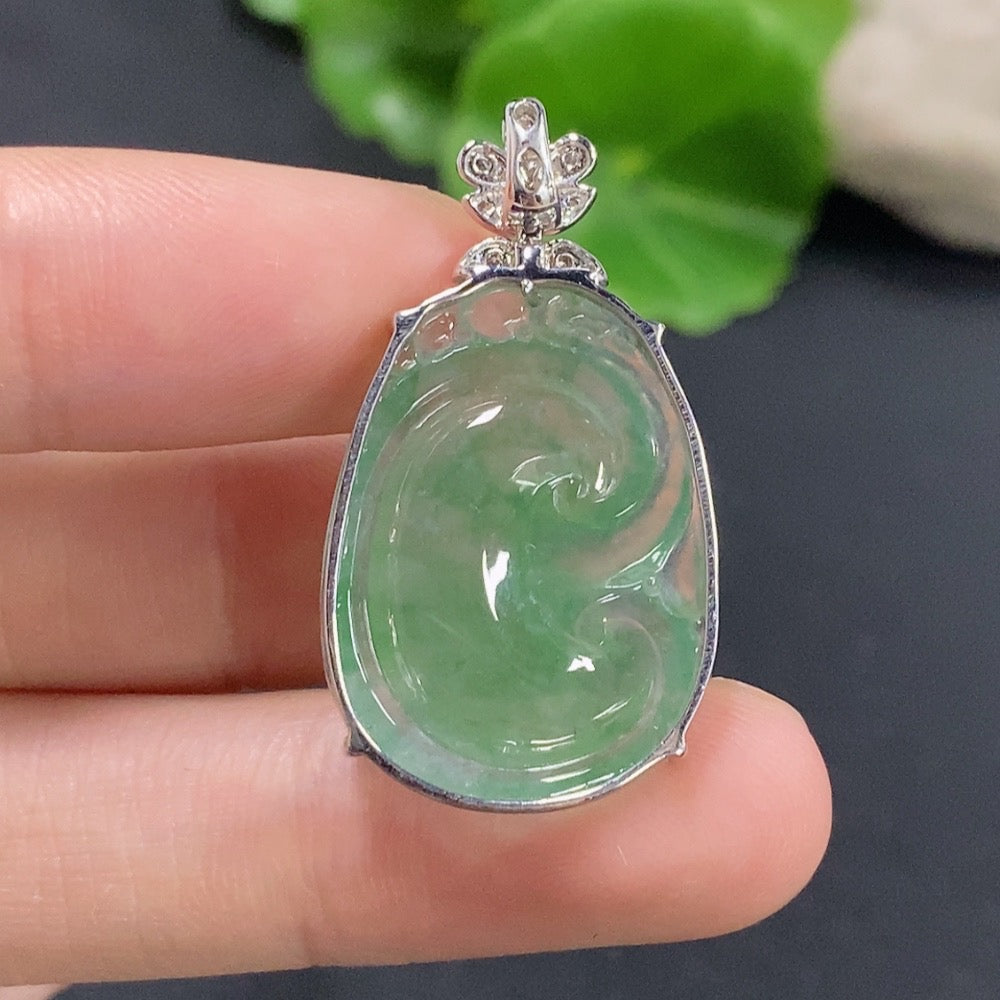 Jadeite Ruyi pendant with 18K gold accents and diamond details, showcasing intricate design and smooth polished jade surface.