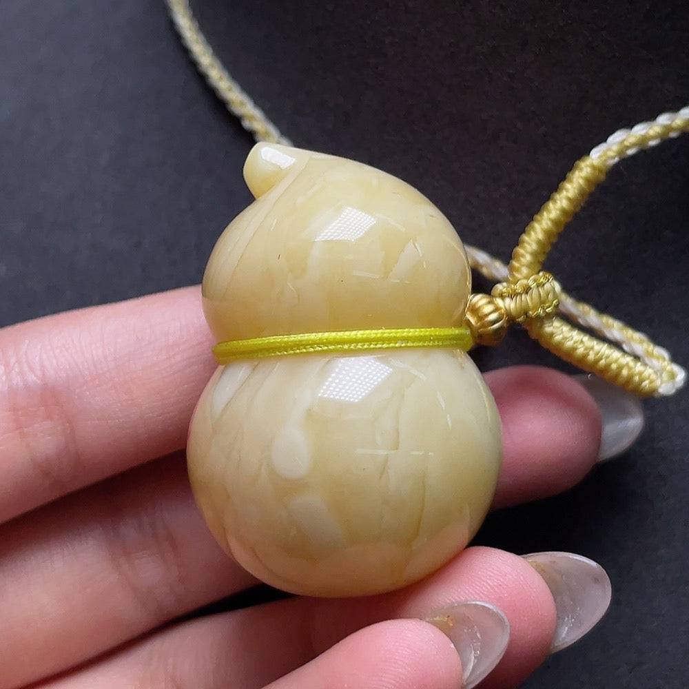 HUILIU HQ amber beeswax pendant with visible partial repairs, handmade jewelry, natural amber with warm golden tones