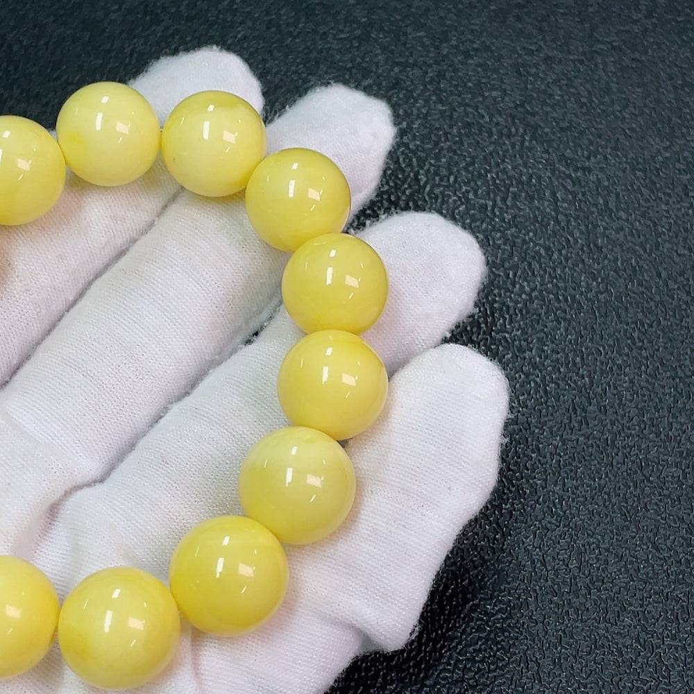 Huiliu Amber Beeswax Bracelet with 13.3mm beads, natural amber color, handcrafted jewelry, certified by HUILIU HQ