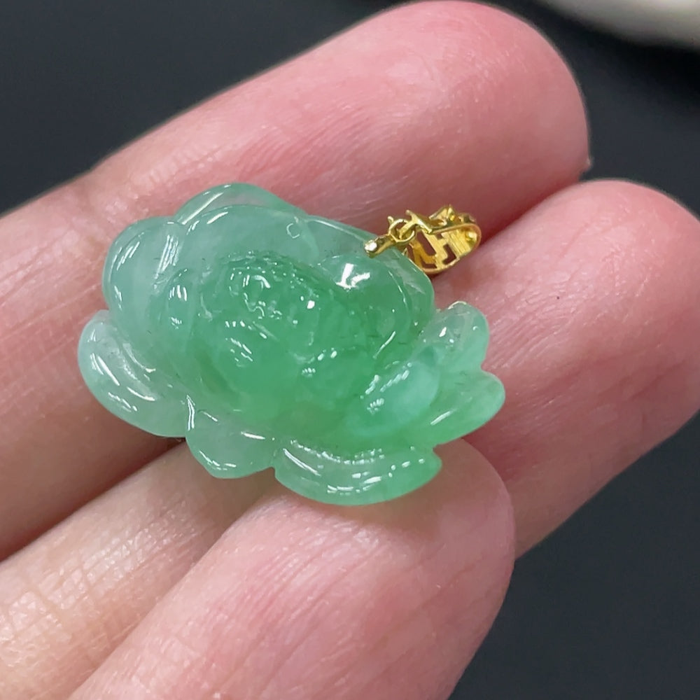 Jadeite lotus pendant with 18k gold clasp, weighing approximately 3.38g, featuring intricate lotus flower design on jade jadeite gemstone.