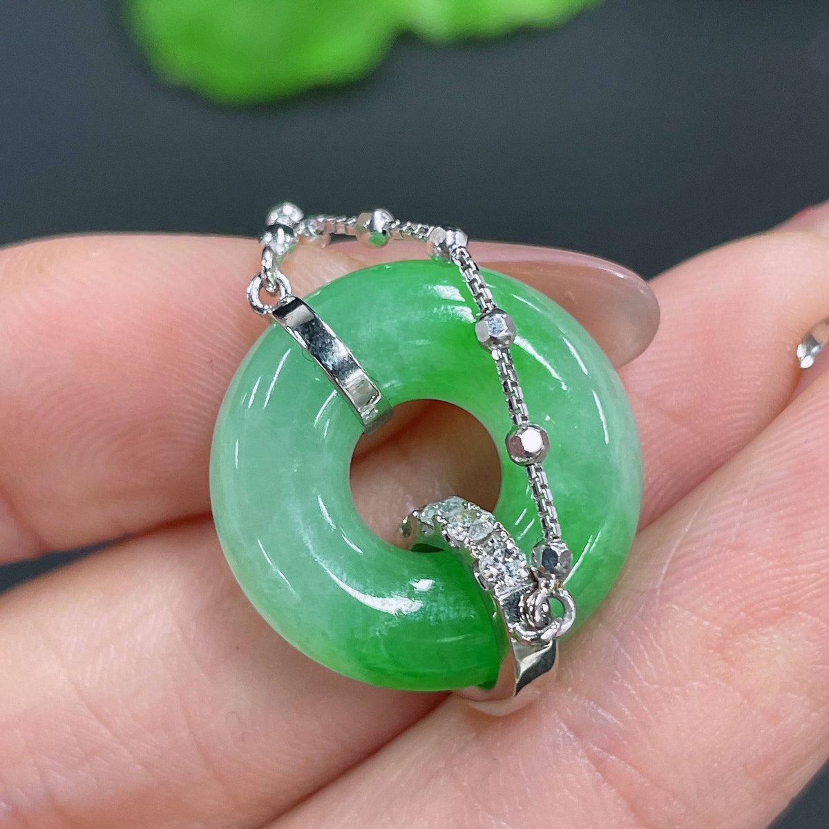Jadeite pendant by HUILIU HQ featuring 18k gold inlay and diamond accents, weighing approximately 7.81 grams.