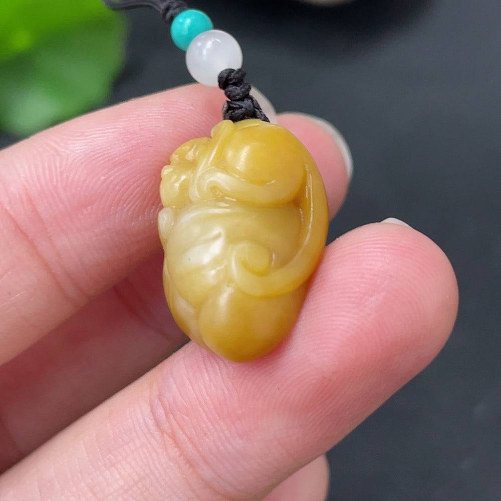 Hetian Jade Spirit Monkey pendant with rope from HUILIU HQ, featuring non-Hetian jade beads and natural skin color variations.