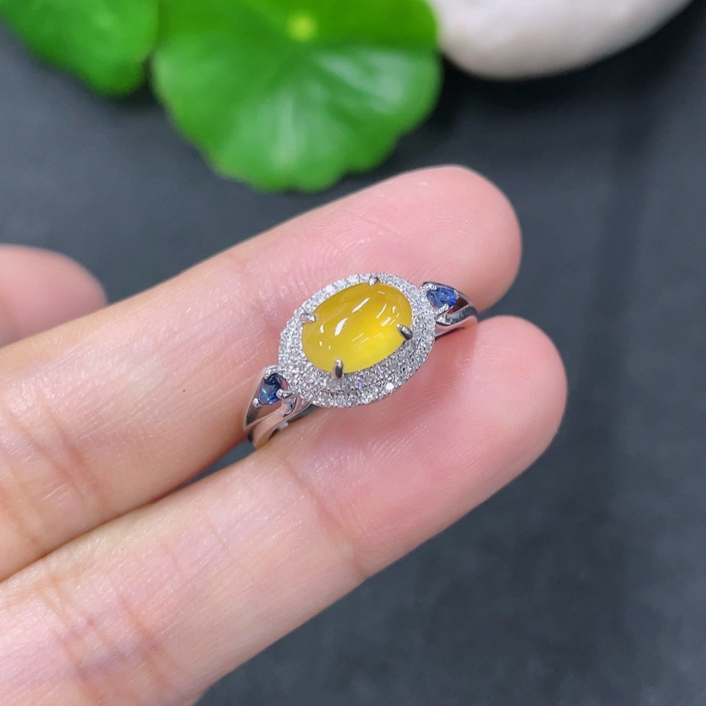 Jadeite inlaid ring by HKHQ featuring 18k gold with diamond accents, size 13, showcasing intricate jade and gold craftsmanship.