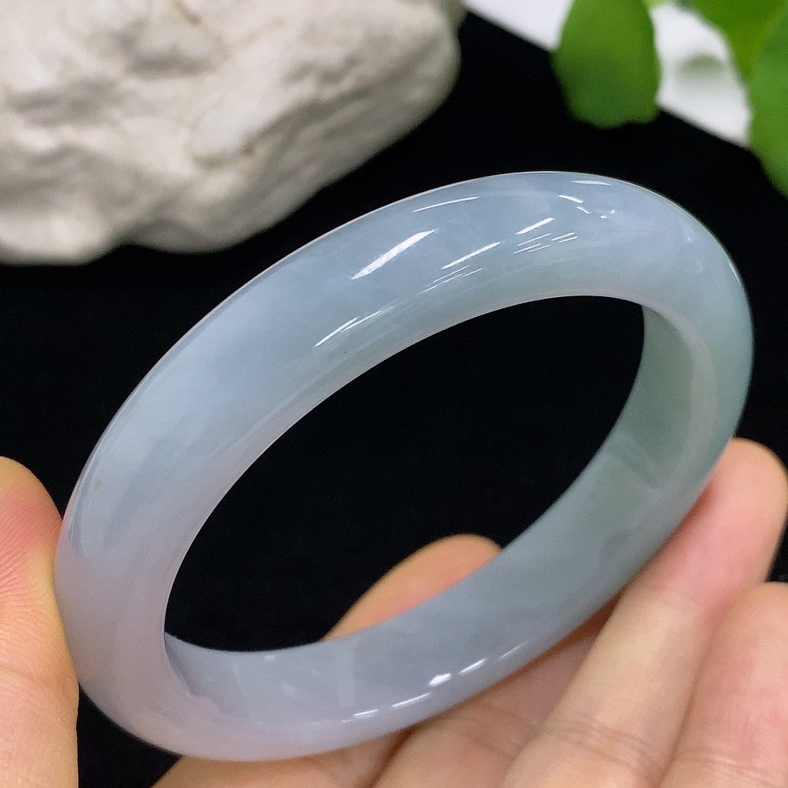 HKHQ jadeite round bangle, size 57.5, smooth green jade with polished finish, weighs approximately 57.64g.