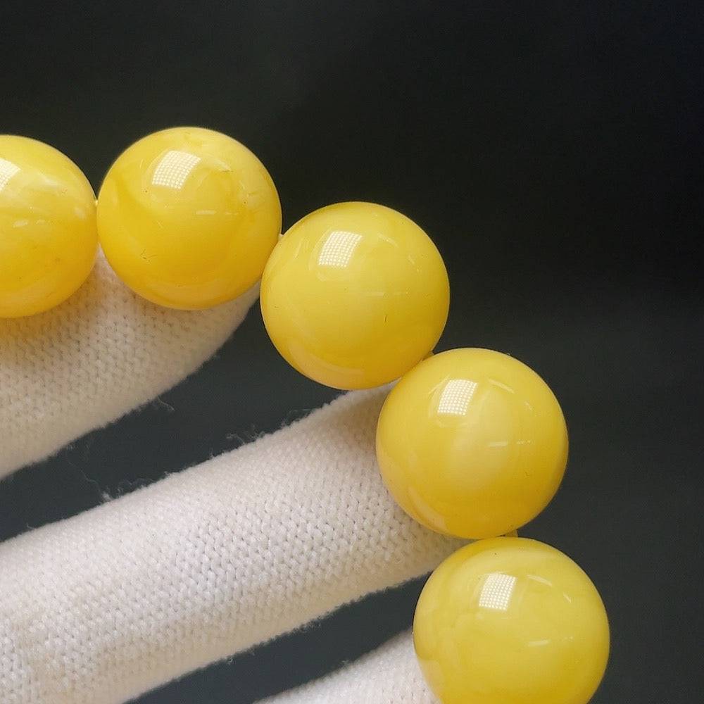 Amber Beeswax Bead Bracelet by HUILIU HQ featuring 16.1mm amber beads on a stylish bracelet design.