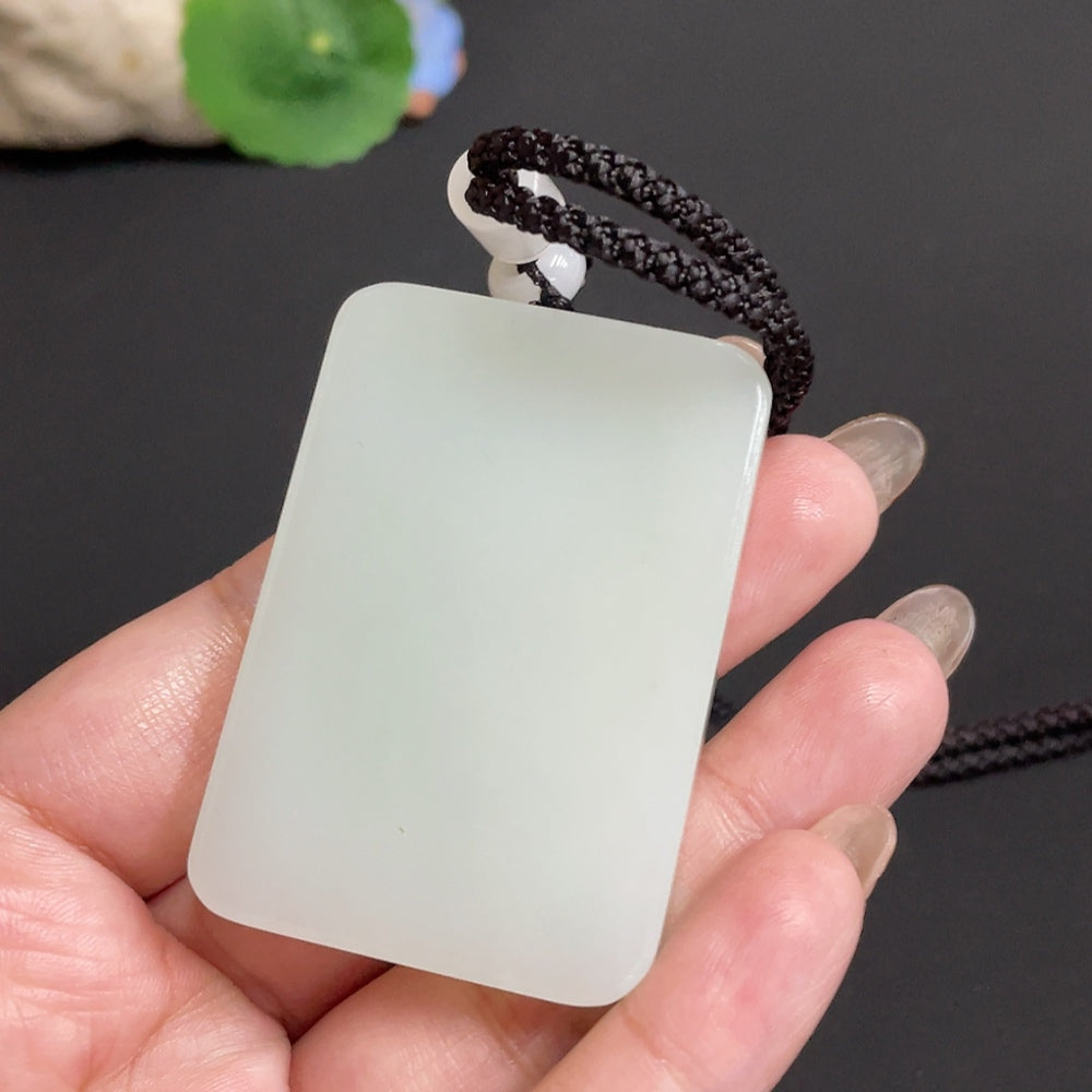Huiliu certified Hetian jade pendant with plain design, showcasing smooth, polished jade stone on a neutral background.