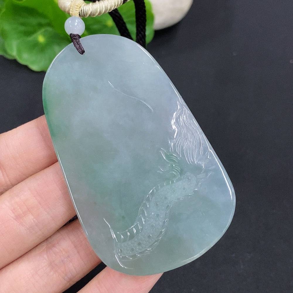 Jadeite Amitabha pendant made of green jade, intricately carved, hanging from a silk cord, crafted by HUILIU HQ.