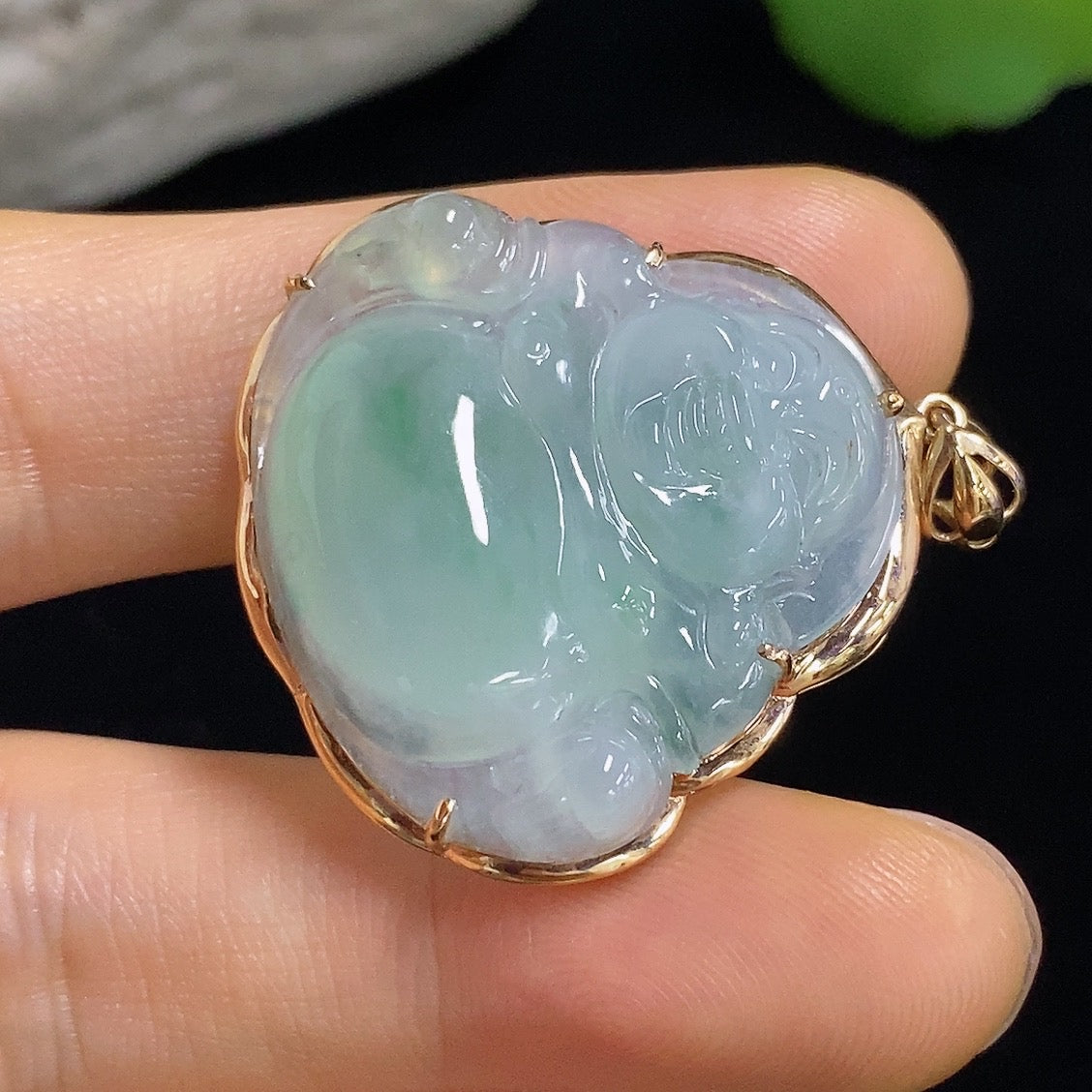 Jadeite Buddha pendant with 18k gold mounting, weighing approximately 6.31g, displayed against a neutral background.
