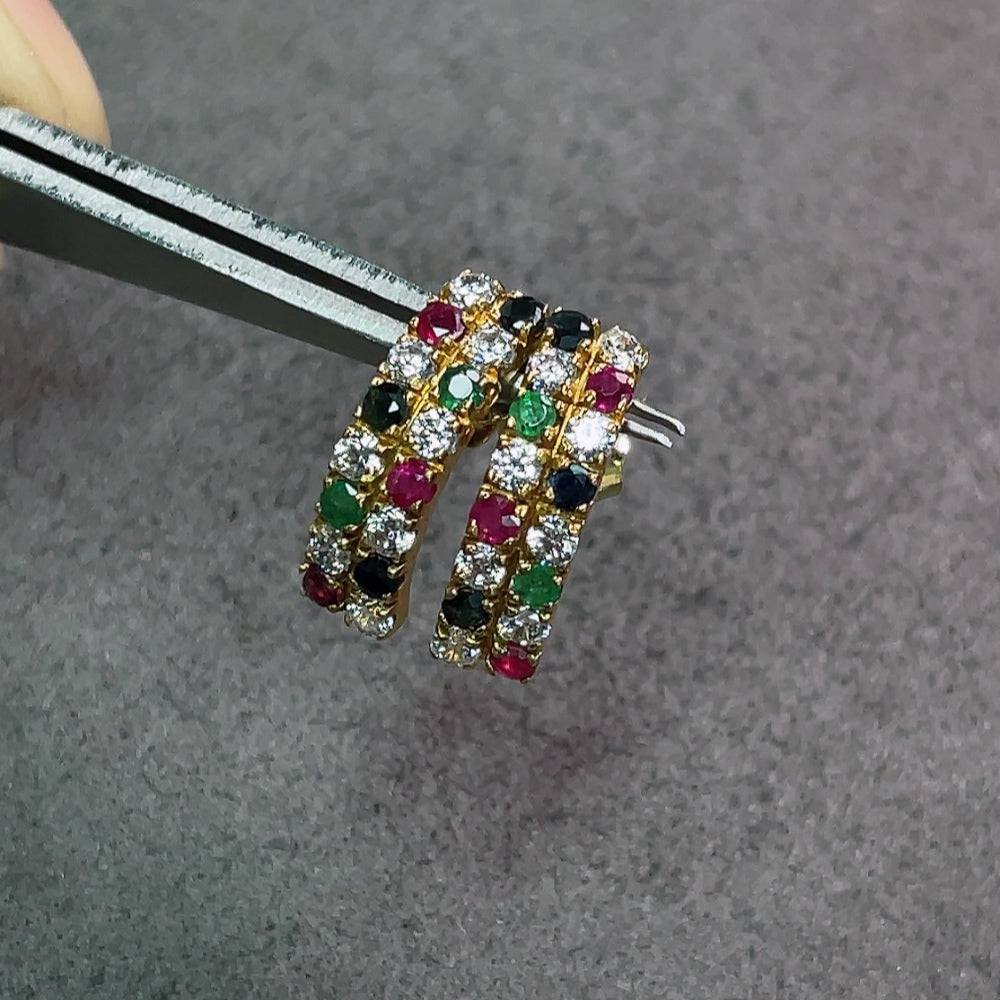 Huiliu Emerald earrings with sapphire and ruby gemstones, featuring clarity-enhanced emeralds and intricate gemstone details.