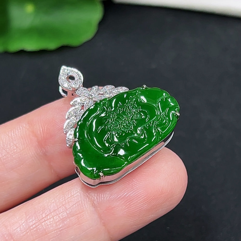 Jadeite pendant with 18K gold setting accented with diamonds, displayed on a necklace chain.