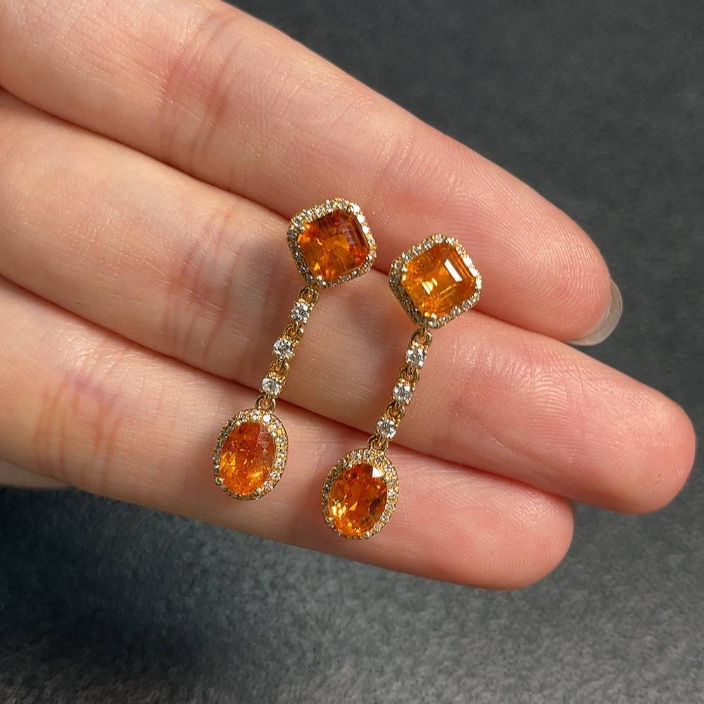 Huiliu Garnet gemstone earrings with diamond accents, featuring rich red garnets and sparkling diamond details.