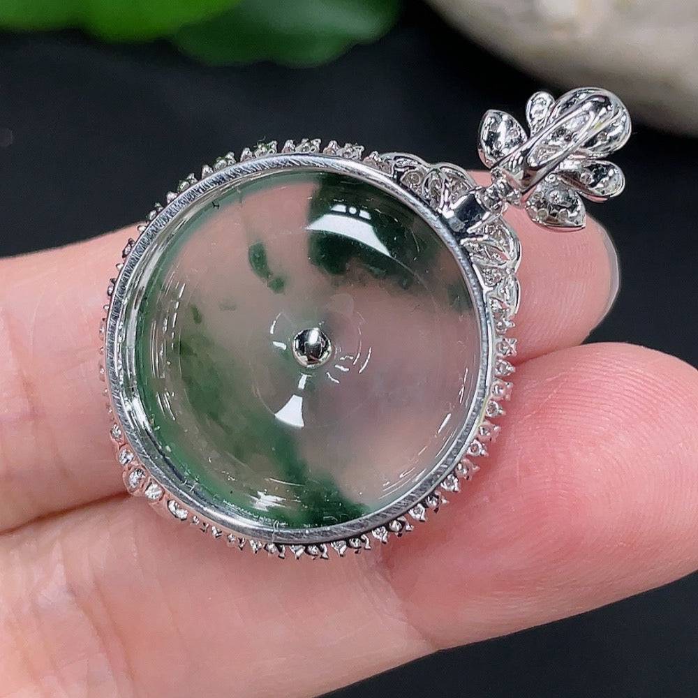 Jadeite peace knot pendant by HUILIU HQ with 18K gold accents and diamond details, showcasing the intricate design and craftsmanship.