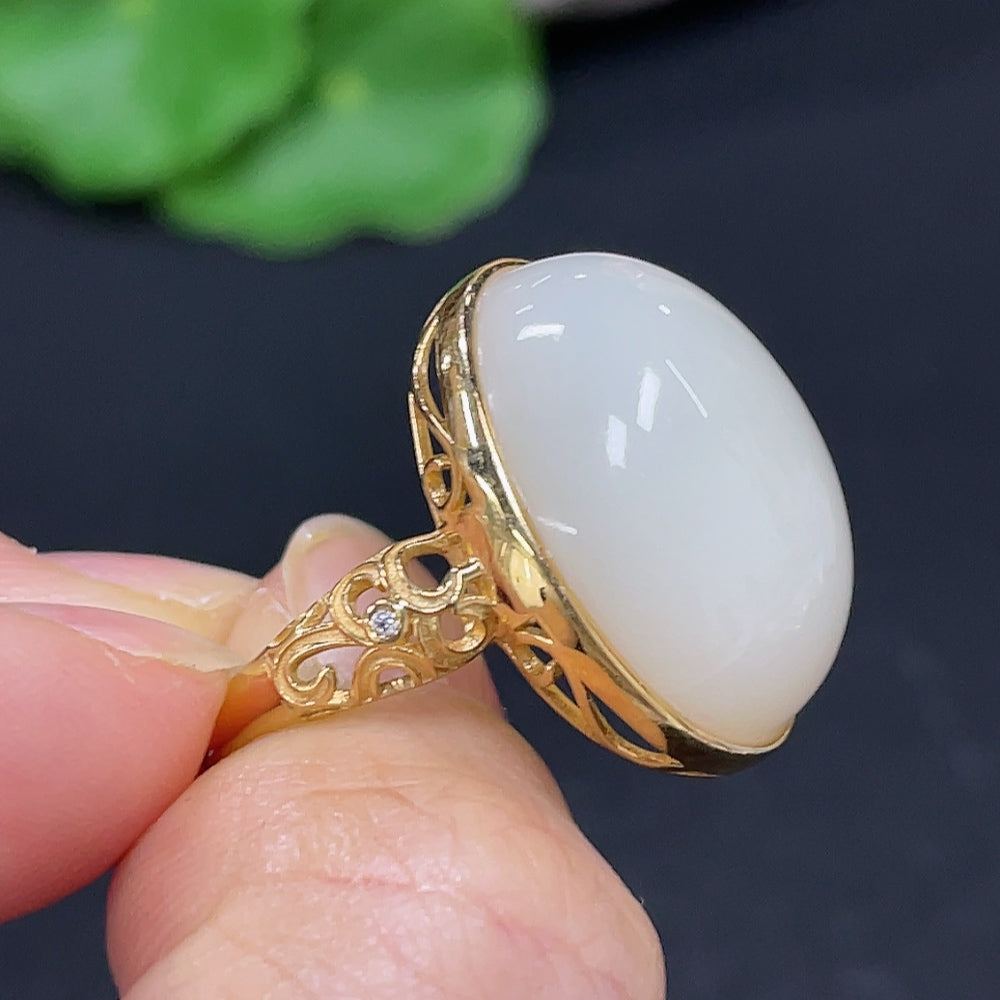 HKHQ Hetian Jade cabochon inlaid ring featuring a smooth, polished green jade stone set in a detailed metal band.