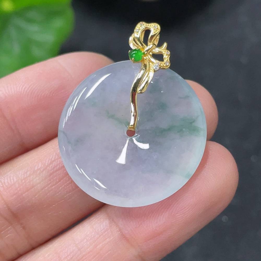 Jadeite Peace Knot pendant with 18k gold clasp, weighing approximately 5.22g, showcasing intricate jade design without diamonds.