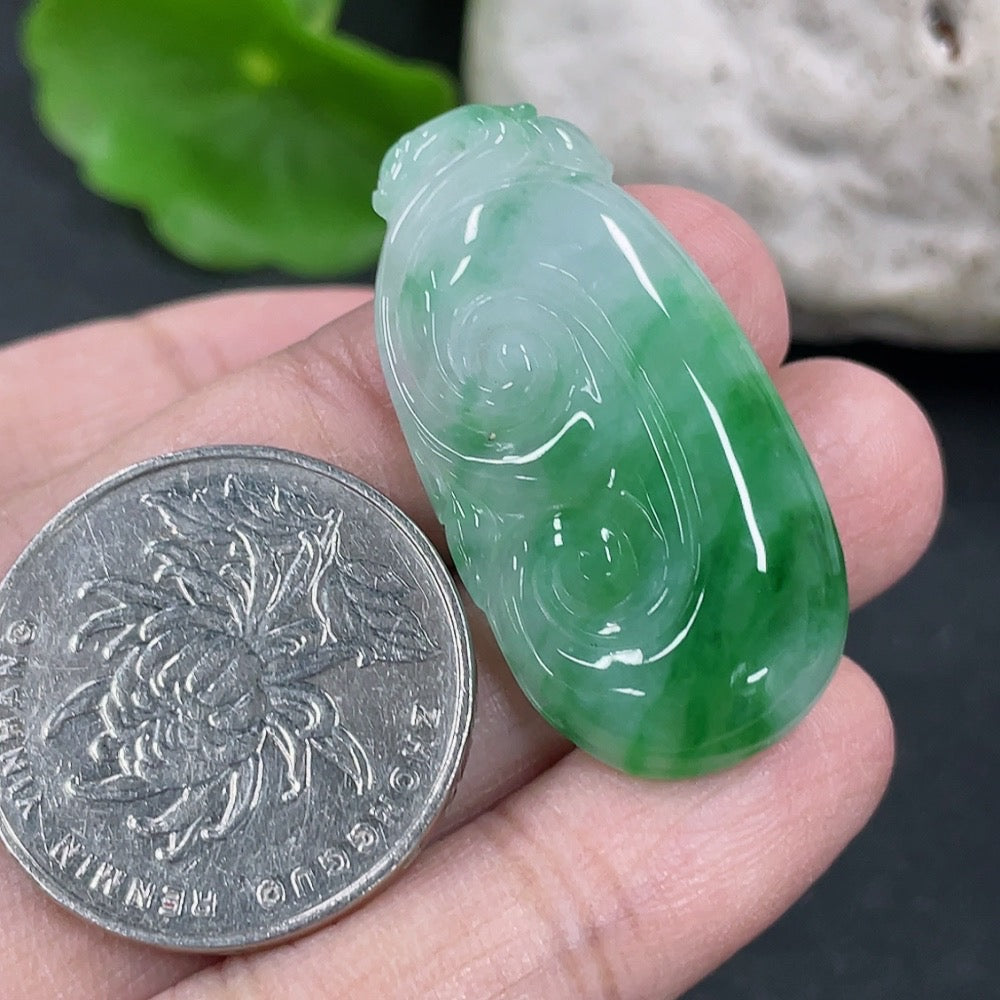 Jadeite Ruyi pendant necklace with intricate carvings, featuring smooth green jadeite stone, crafted by HKHQ.