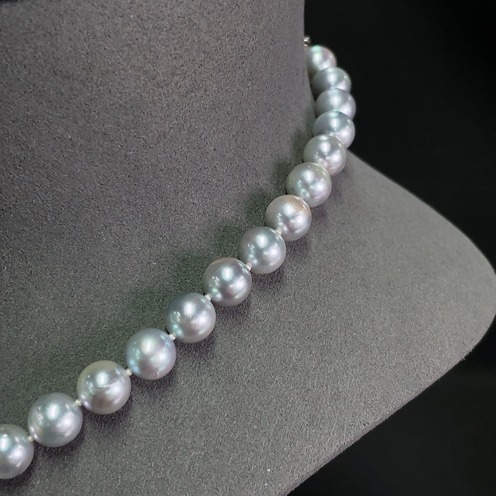 Saltwater pearl strand necklace by HKHQ featuring lustrous white pearls, non-gold design, elegant and classic jewelry piece.