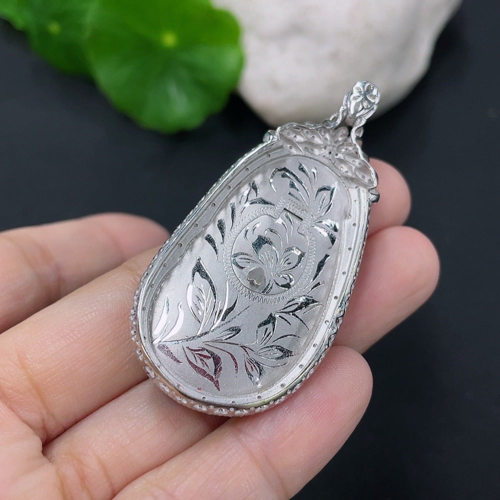 Jadeite Ruyi pendant with 18K gold and diamond accents, showcasing intricate inlay work and elegant design.
